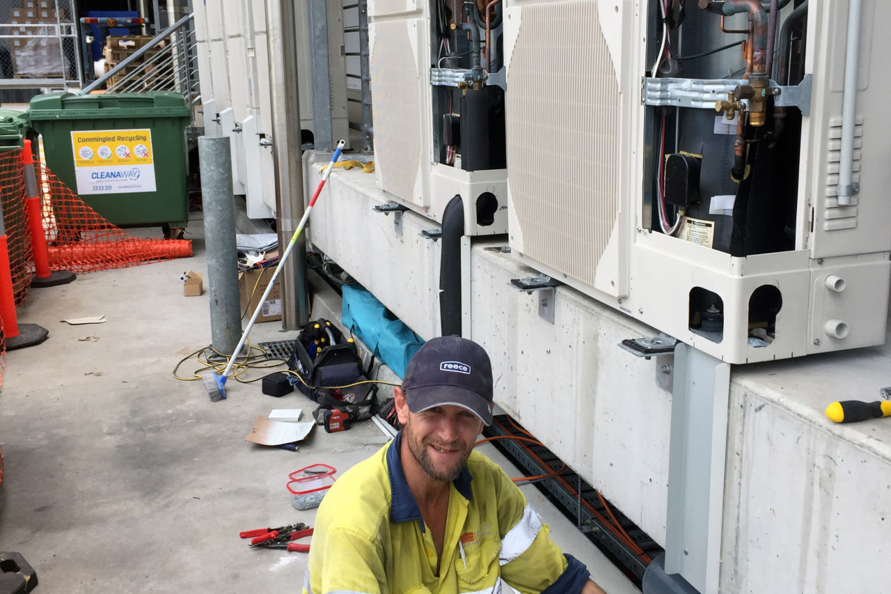 Edan Rayner-Sharp working diligently at the project installing DX refrigeration systems. 